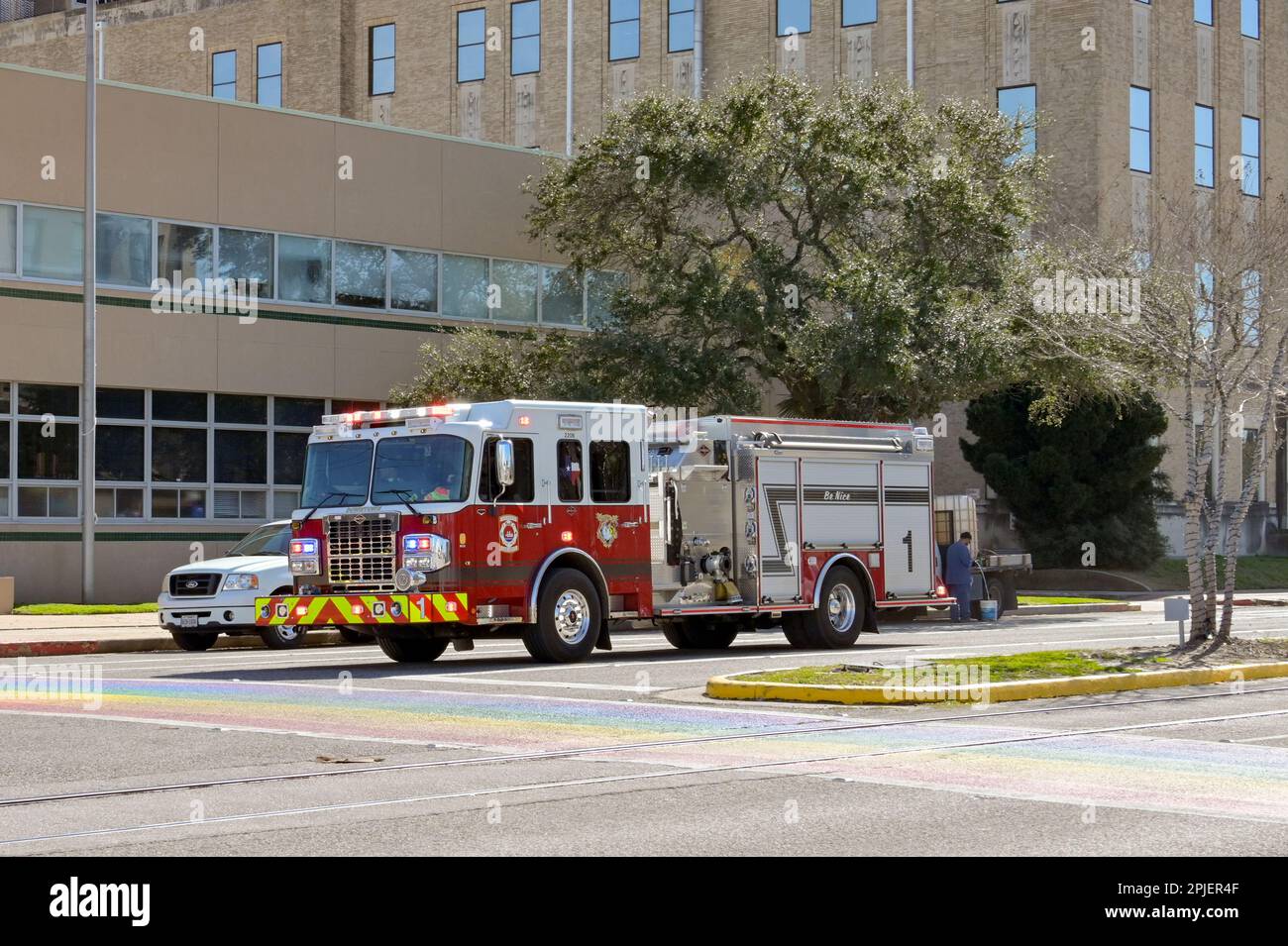 Galveston, Texas, USA - February 2023: Fire department truck with lights flashing driving on one of the city's streets Stock Photo