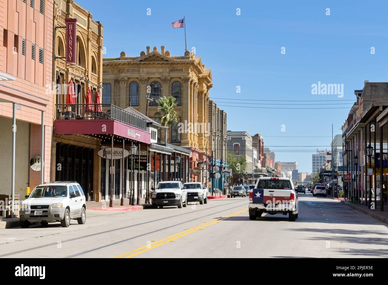 galveston-texas-usa-february-2023-traffic-on-a-street-of-historic
