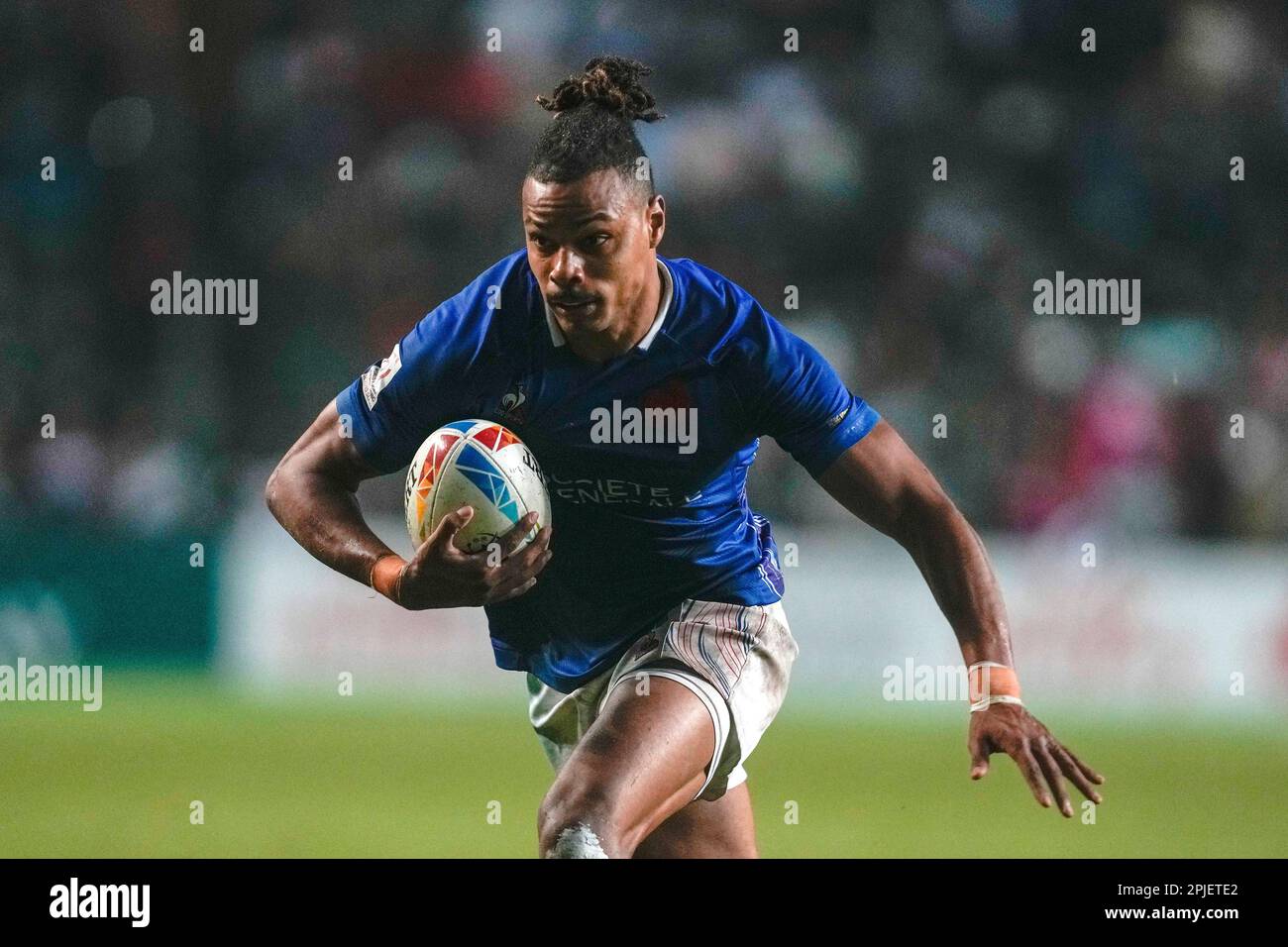 France's Joseph Jefferson Lee runs to score a try during the bronze