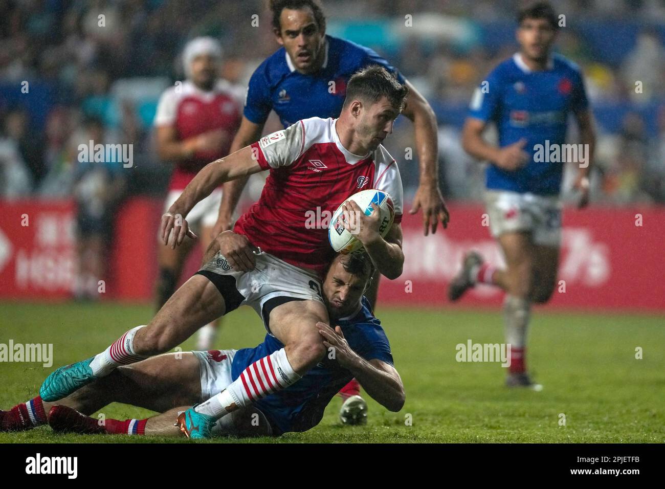 Britain's Morgan Williams, bottom, is tackled during the bronze medal ...