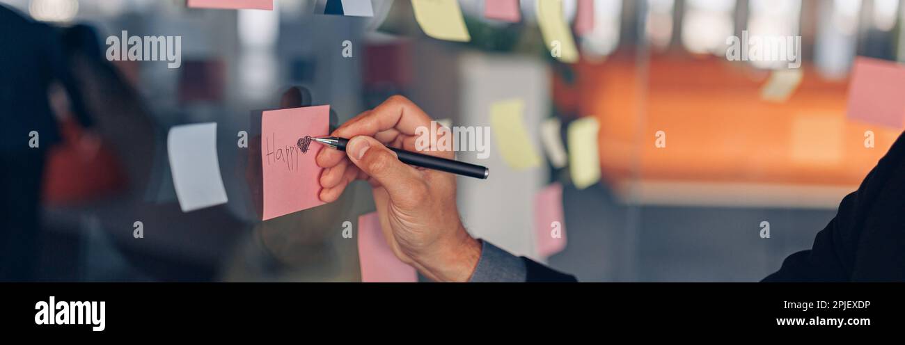 Businesswoman hand's is writing on sticky notes on motivation board in ...