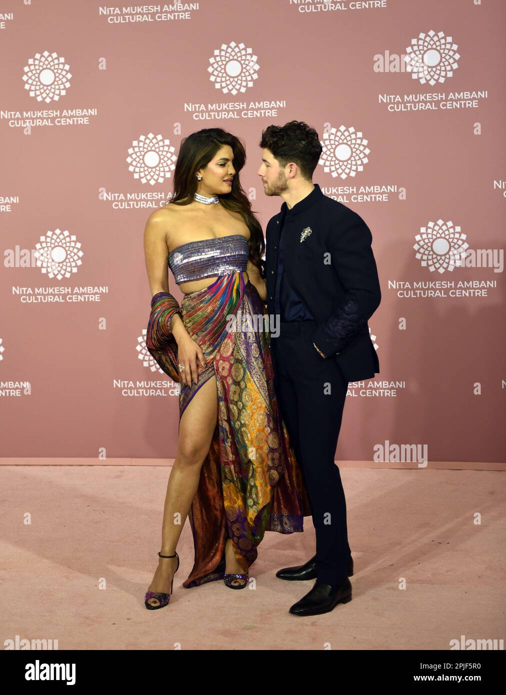 Indian actress Priyanka Chopra Jonas (L) and her husband Nick Jonas (R) pose for a photo shoot on the red carpet during the second day of the opening of Nita Mukesh Ambani Cultural Centre in Mumbai, India, 01 April, 2023. (Photo by Indranil Aditya/NurPhoto) Credit: NurPhoto SRL/Alamy Live News Stock Photo