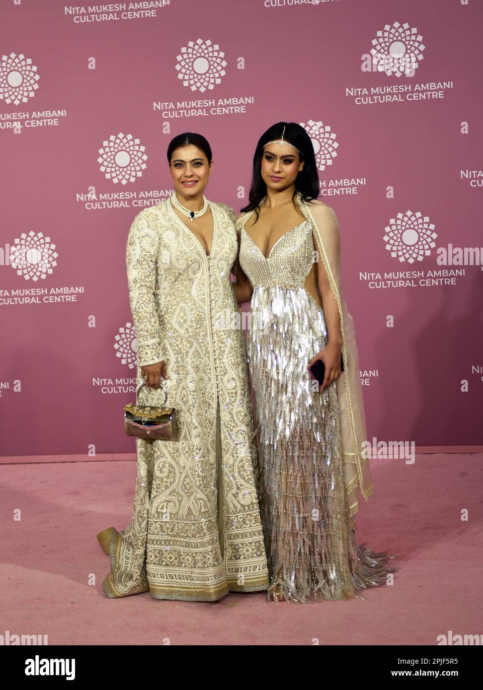 Mumbai, India. 01st Apr, 2023. Indian actress Kajol (L) and her daughter Nysa Devgan (R) poses for a photo shoot on the red carpet during the second day of the opening of Nita Mukesh Ambani Cultural Centre in Mumbai, India, 01 April, 2023. (Photo by Indranil Aditya/NurPhoto)0 Credit: NurPhoto SRL/Alamy Live News Stock Photo