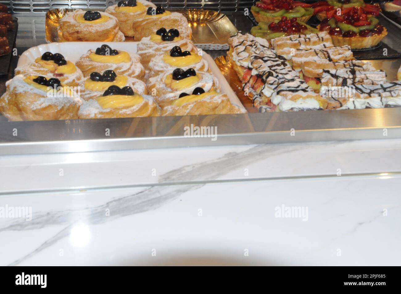 Patisserie display cakes artisanal bakery in italy bar Stock Photo Alamy