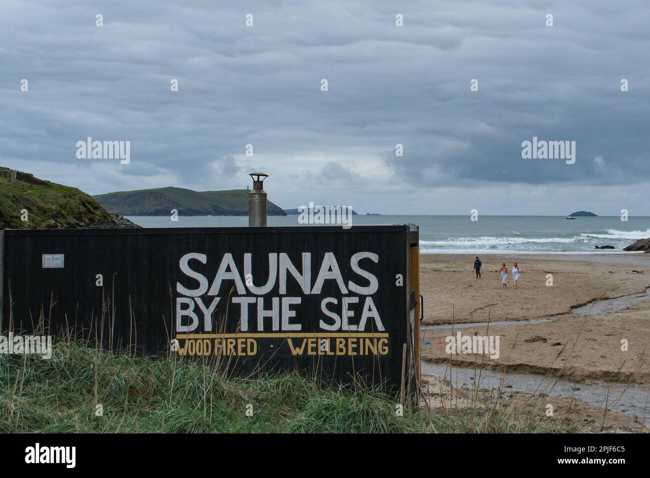 Wood fired sauna on the beach at Polzeath, Cornwall with the signage