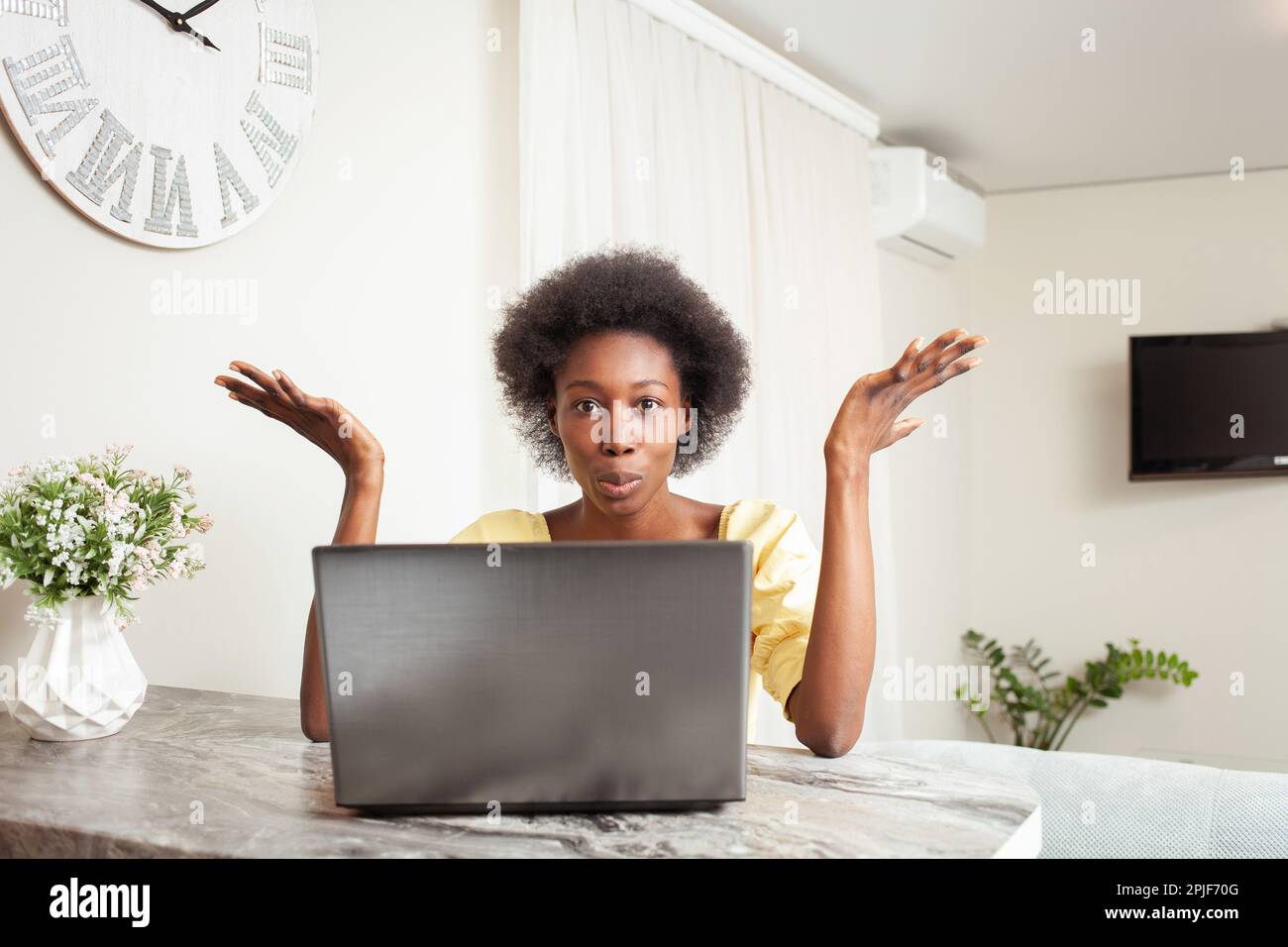 a African American Black Woman Portrait House. Indoor, woman is surprised, stunned, angry, mouth open. Winning, bug, laptop broken, lottery, job vacan Stock Photo