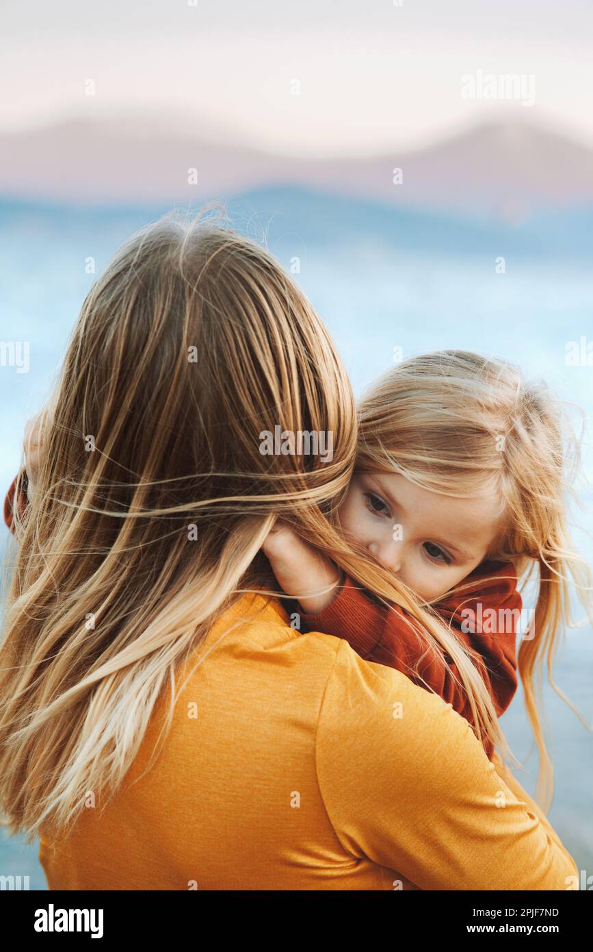 Mother and daughter hugging family lifestyle candid emotions travel