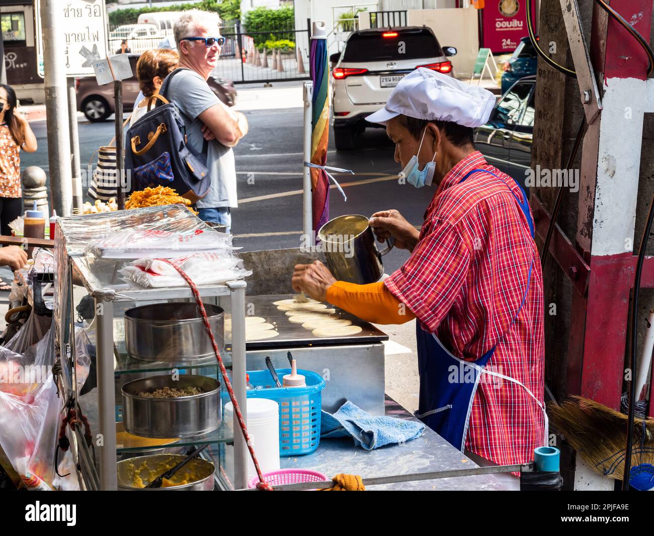 Sizzling pans, aromatic spices, and a skilled street chef combine to