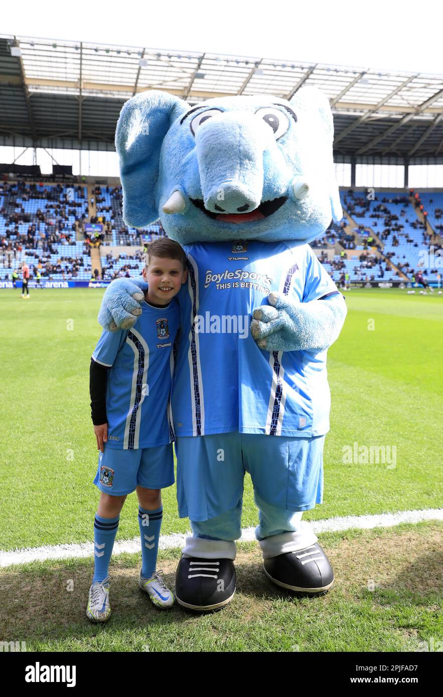 A Coventry City match day mascot poses with Sky Blue Sam ahead of the