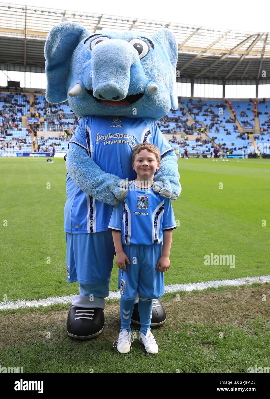 A Coventry City match day mascot poses with Sky Blue Sam ahead of the