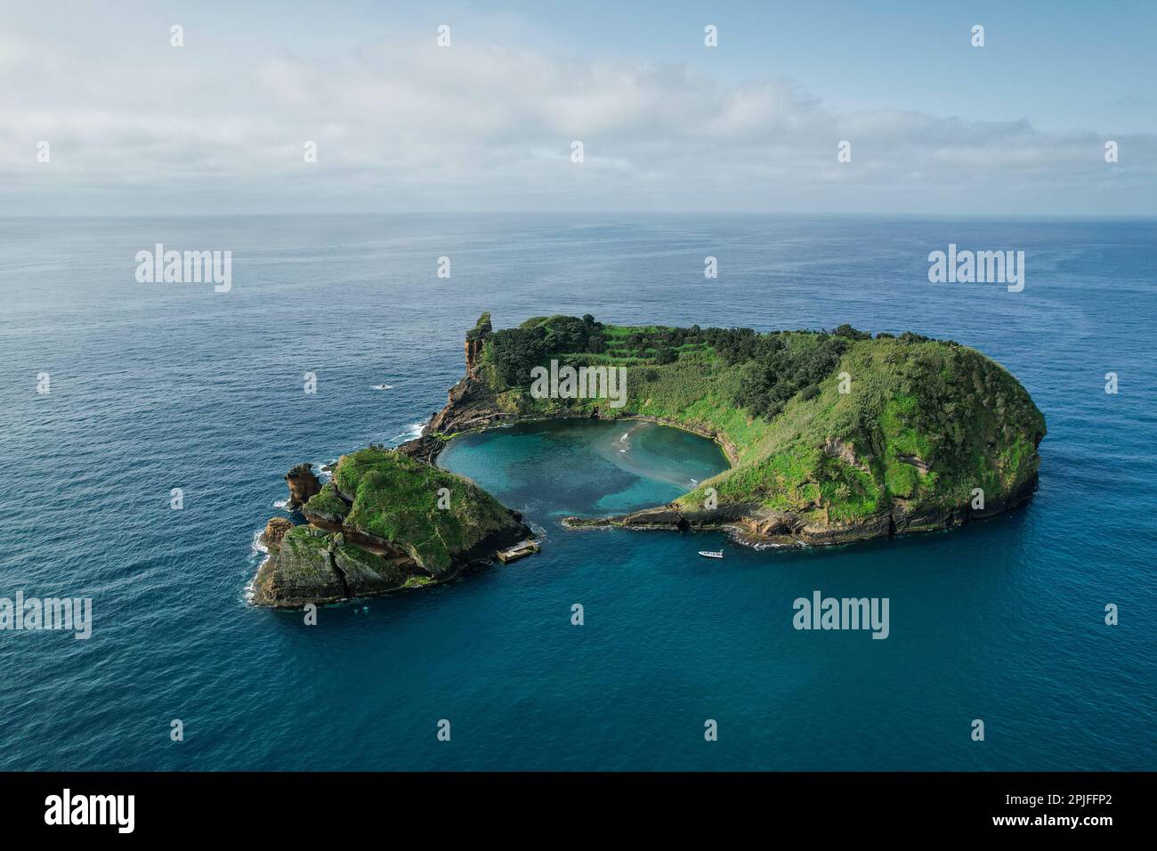 Vila Franca Islet, also known as the Princess Ring is a vegetated uninhabited islet located off the south central coast of the island of Sao Miguel in Stock Photo