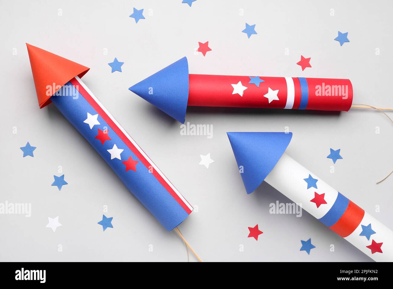 Firework rockets with stars for Independence Day on light background ...