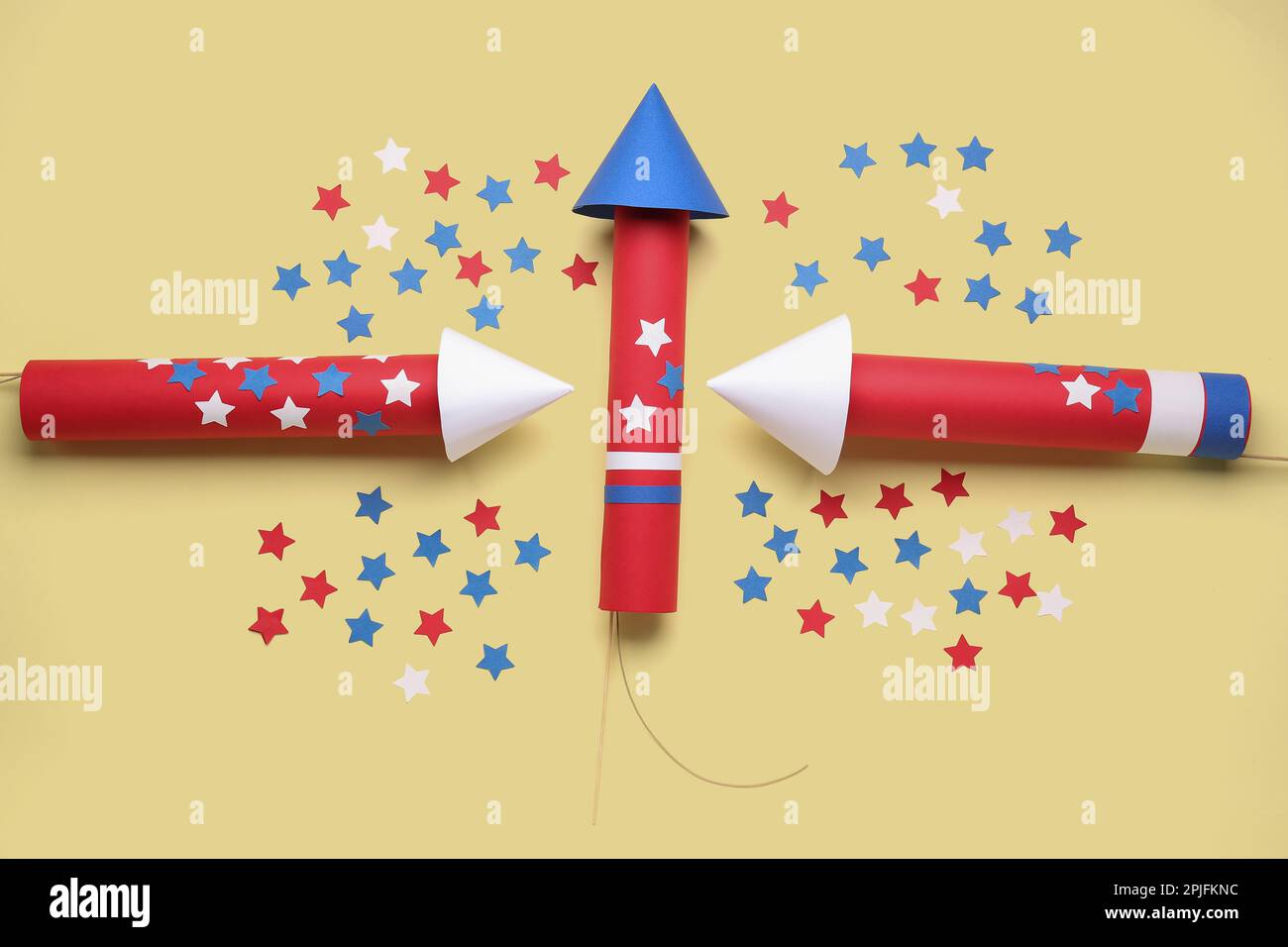 Firework rockets with stars for Independence Day on beige background ...