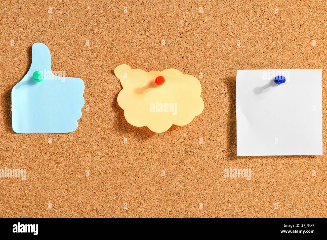 Pinned sticky notes on board Stock Photo