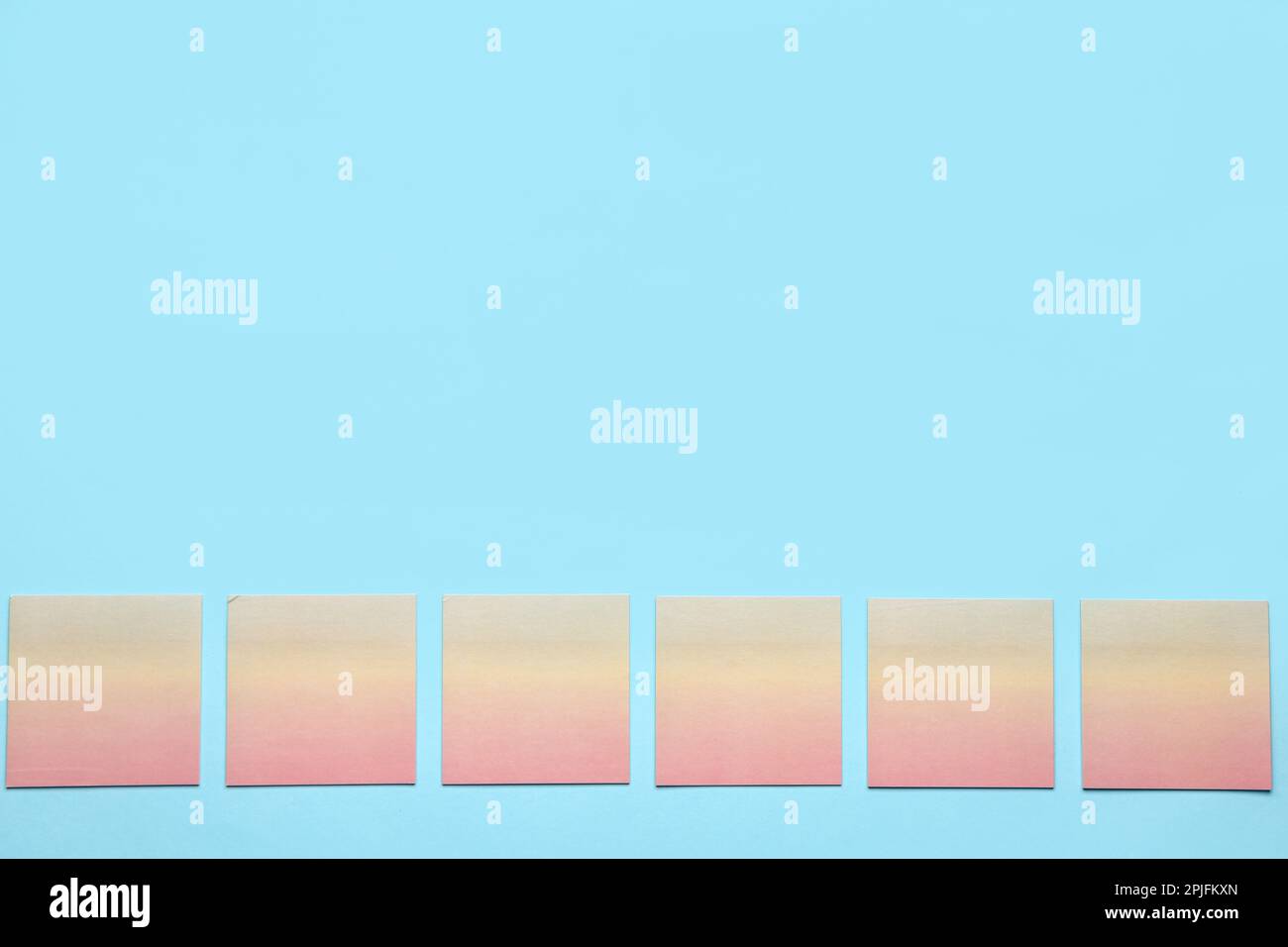 Sticky notes on blue background Stock Photo - Alamy