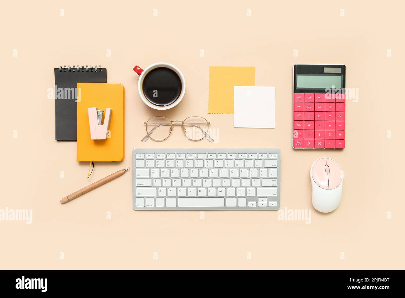 Composition with keyboard, coffee, calculator and notepad on beige background Stock Photo