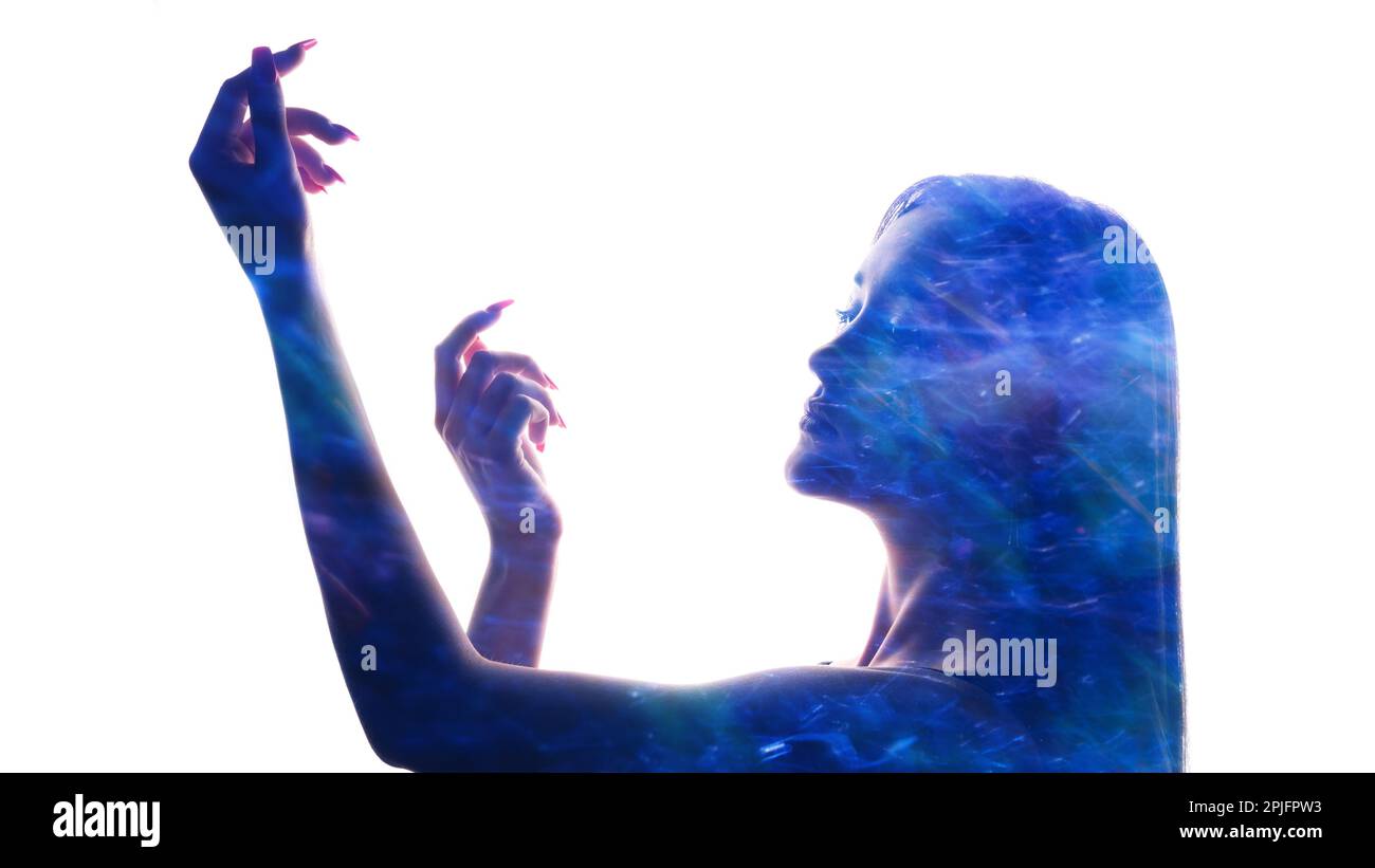 Spiritual enlightenment blue glow woman silhouette Stock Photo