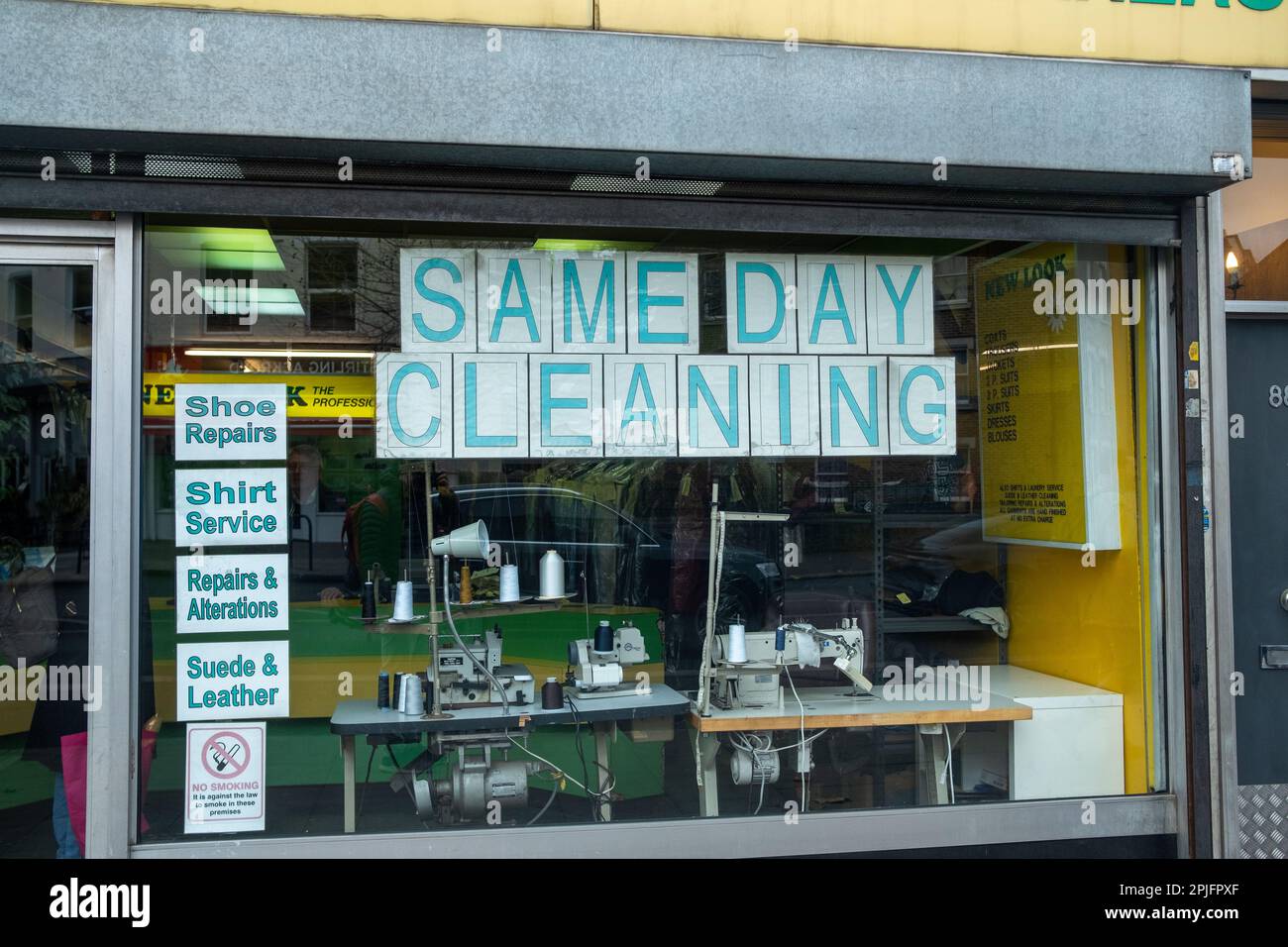 London- February 2023: Dry Cleaning business shop window in Shepherds Bush Stock Photo