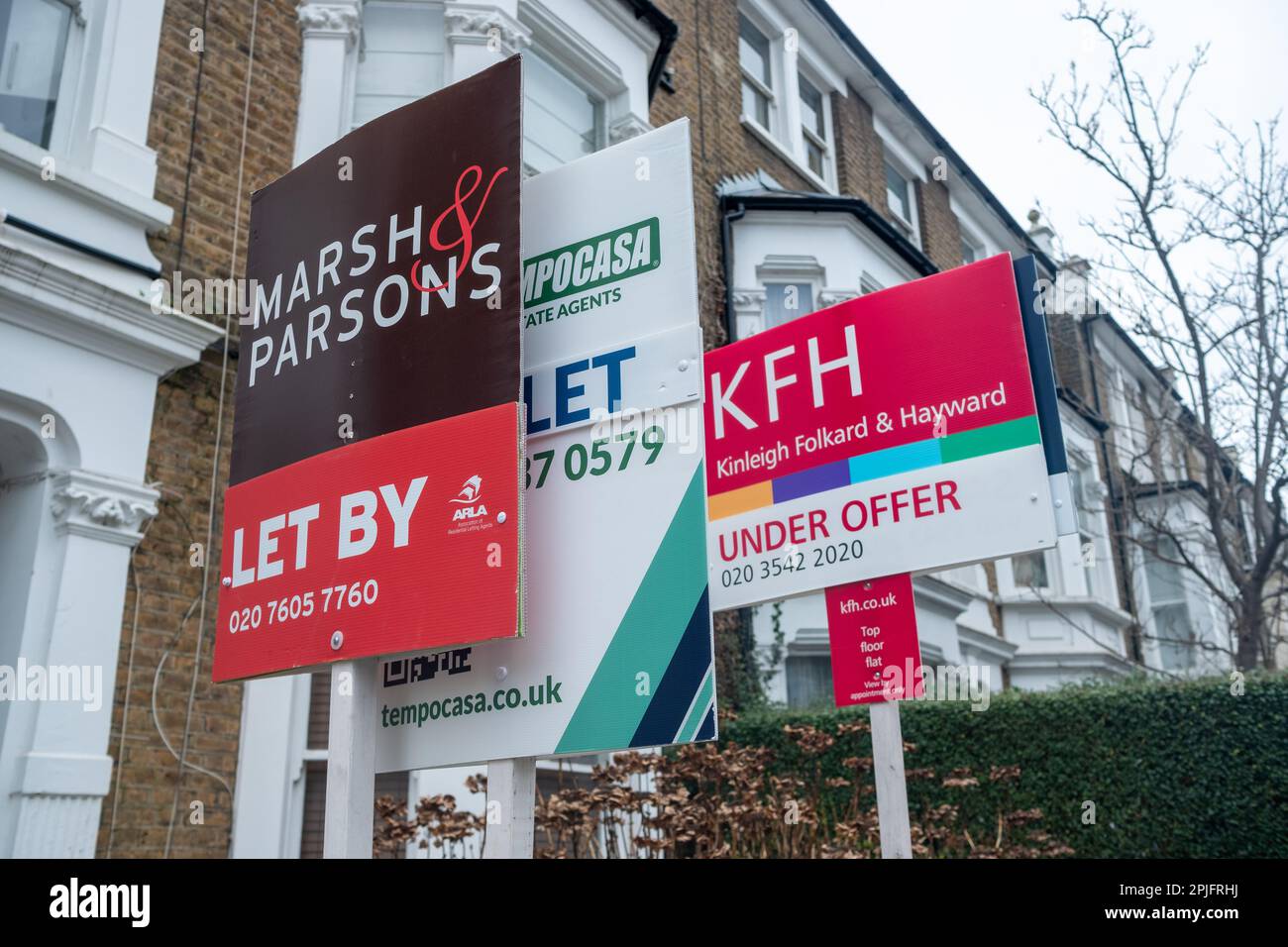 London February 2023 Estate agent signs on street of urban terraced