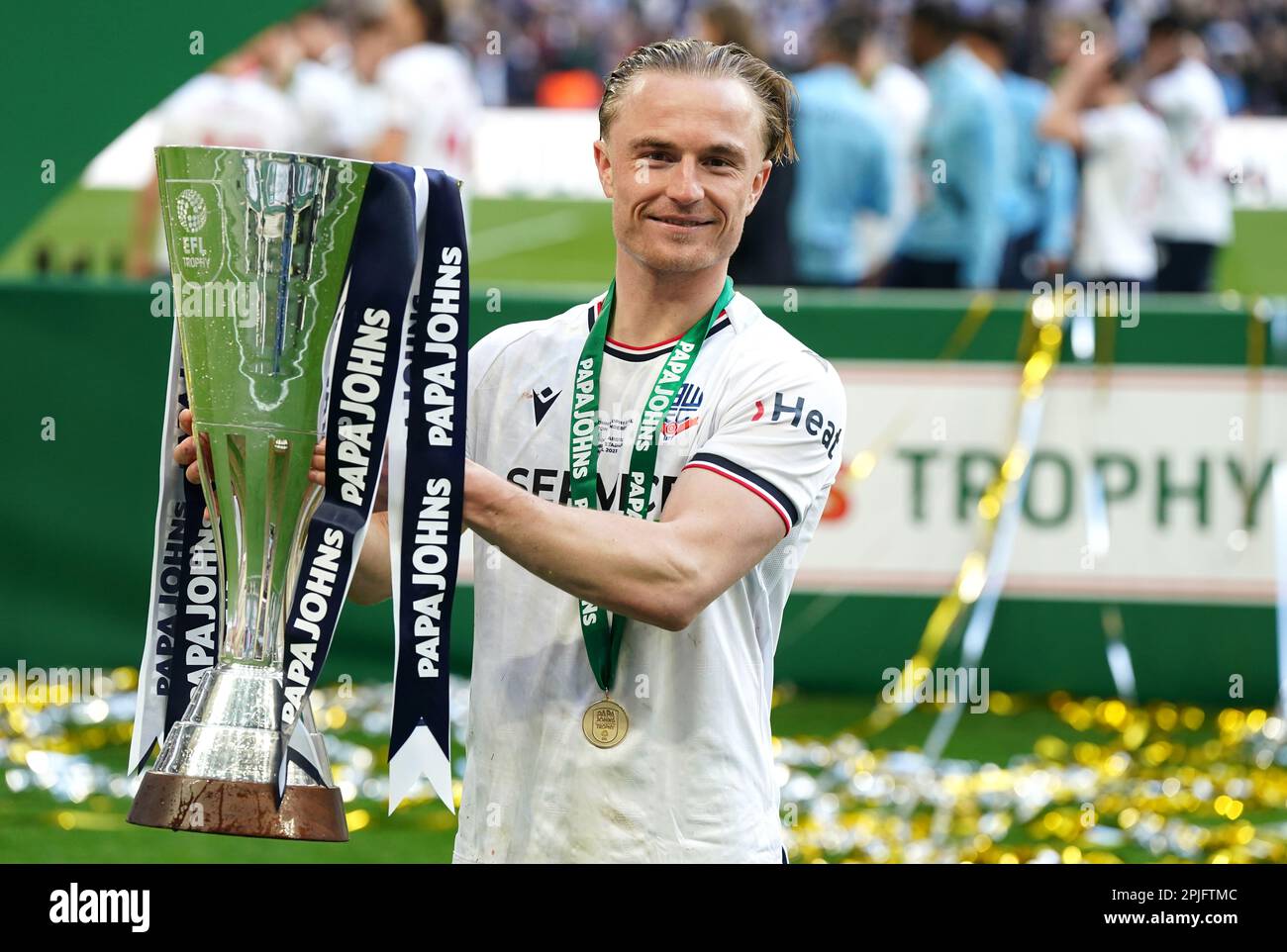 Bolton Wanderers' Kyle Dempsey poses with the trophy after the Papa
