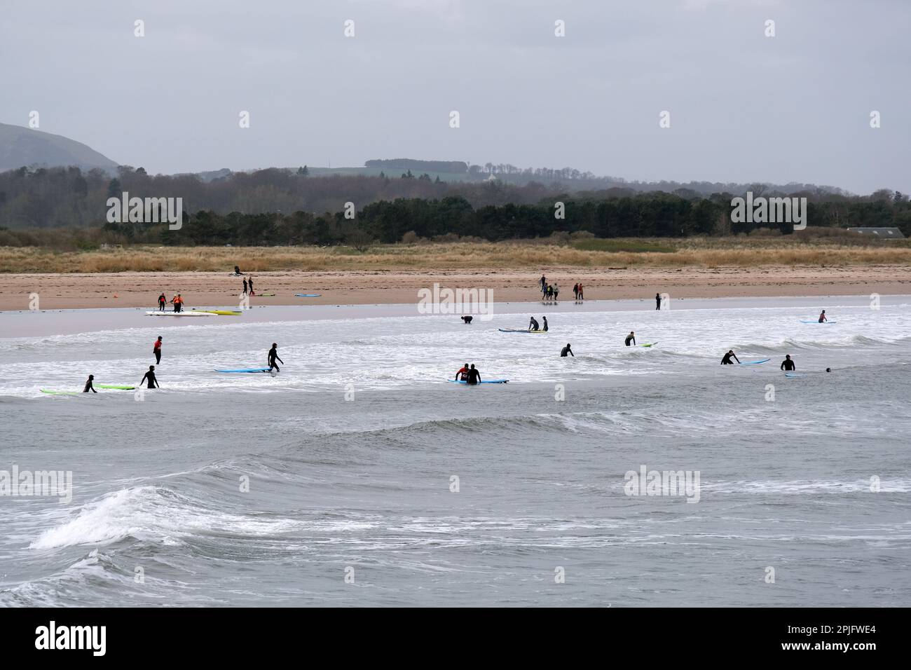 Dunbar, Scotland, UK. 2nd April 2023. People enjoying the Sunny but deceptively cold weather, along the East Lothian coastline at Belhaven Bay. Temperature around 5C in the the breeze. Credit: Craig Brown/Alamy Live News Stock Photo