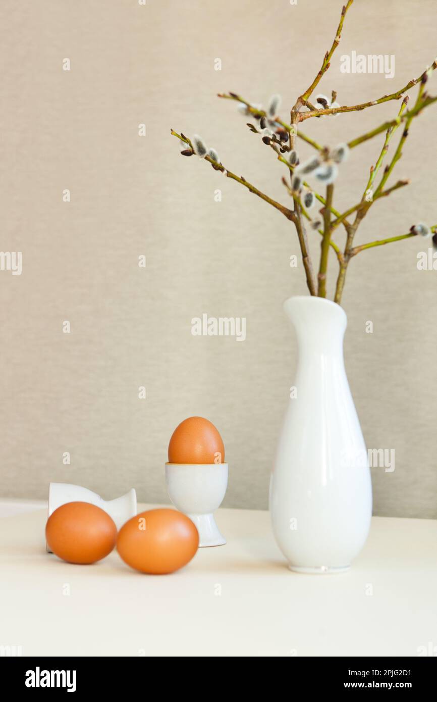 brown easter eggs on the table. Eggs chicken on beige background Stock Photo