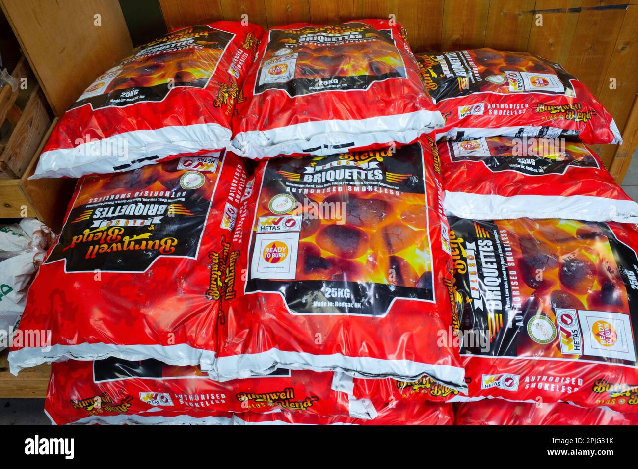 For Sale 25kg bags of Burnwell Blend briquettes smokeless fuel Stock Photo