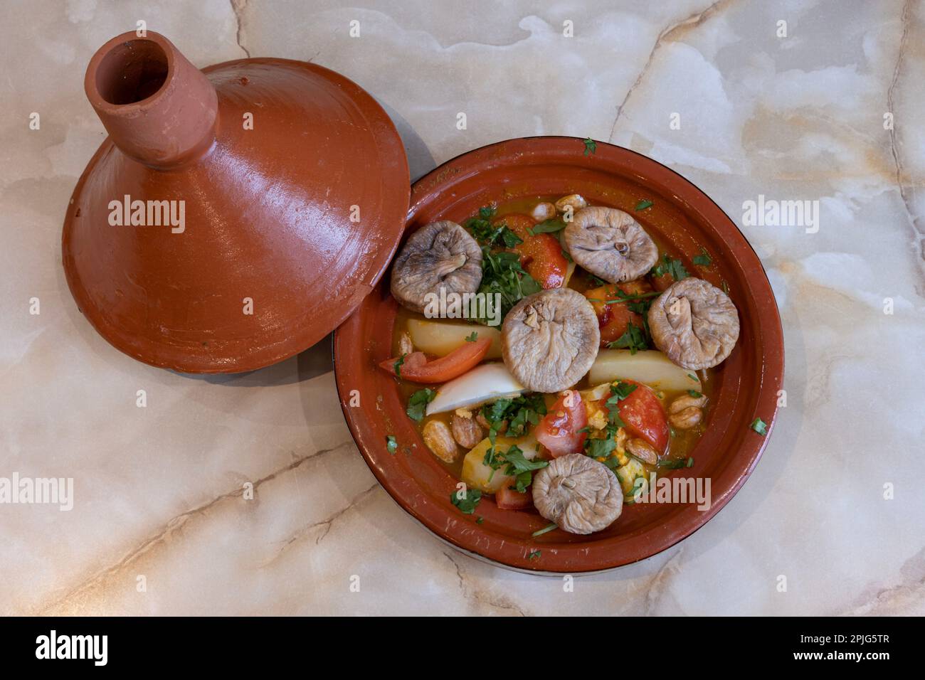 Tunisian dishe culinary Still Life. Tagine with fig and honey Stock Photo