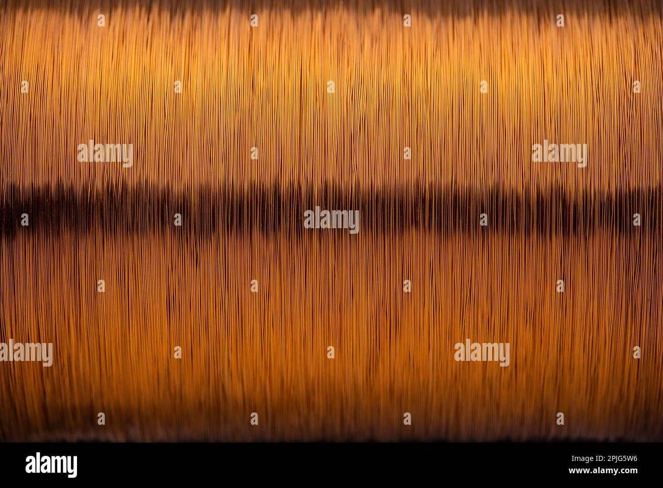 Metal texture of a coil of copper wire, closeup. Coil of thin copper