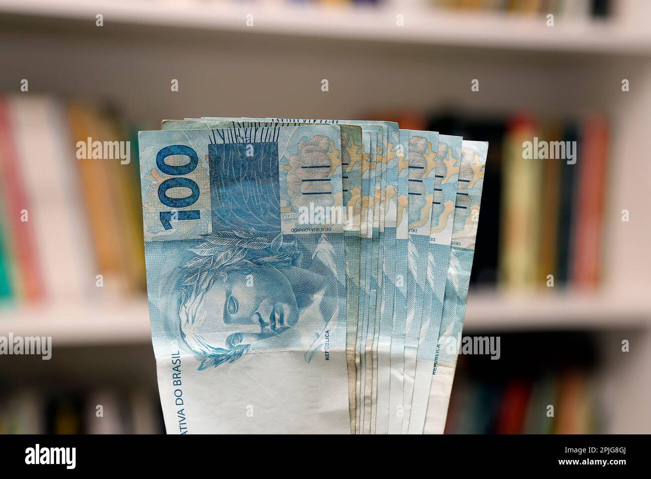 money from brazil stacked on home scene - several hundred real bills Stock Photo