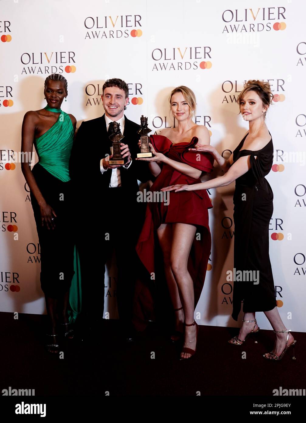Award presenters Sheila Atim (left) and Aimee Lou Wood (right) pose for a photo in the press room alongside Best Actor winner Paul Mescal and Best Actress winner Jodie Comer at the Olivier Awards held at the Royal Albert Hall, London. Picture date: Sunday April 2, 2023. Stock Photo