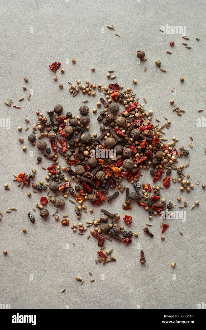 Spices scattered on a gray background, top view Stock Photo