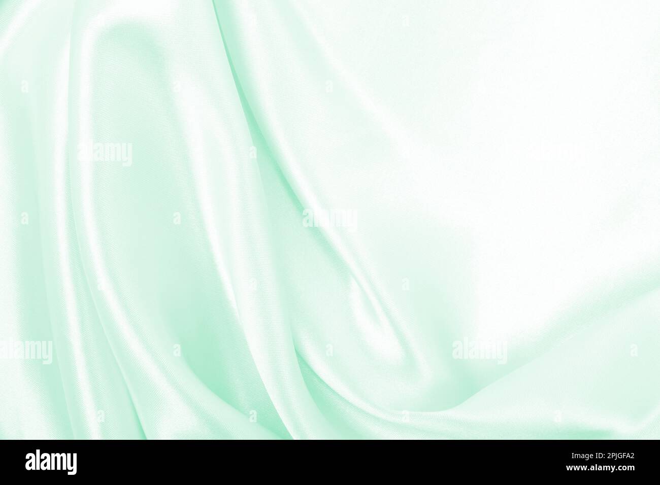 Smooth elegant green silk or satin luxury cloth texture can use as ...