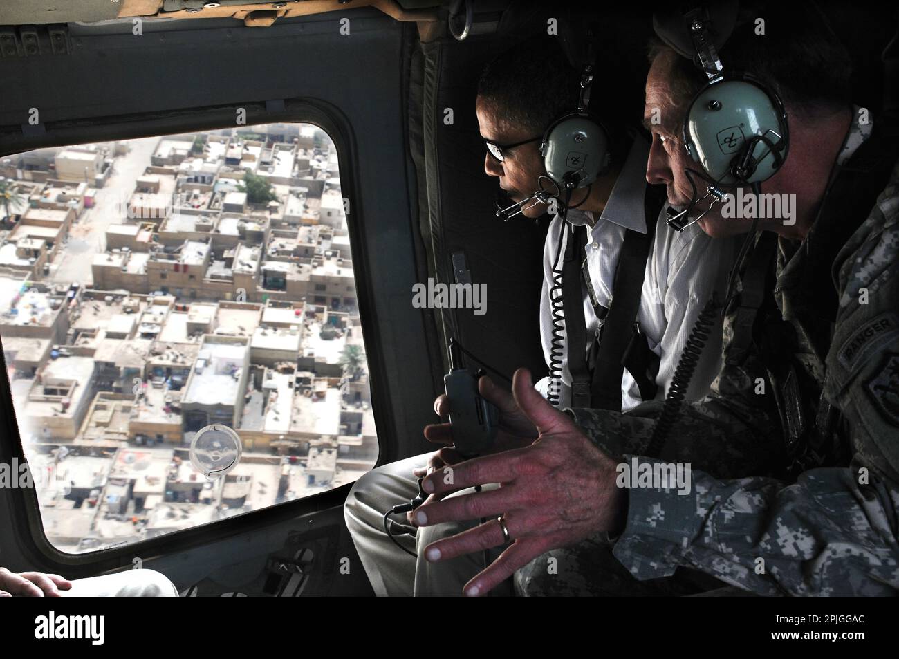 U.S. Army Gen. David H. Petraeus, right, commander of Multi-National Force Iraq, discusses security improvements with Sen. Barack Obama, left, during an aerial tour of Baghdad, Iraq, July 21, 2008.DoD Photo by SSG Lorie Jewell Stock Photo