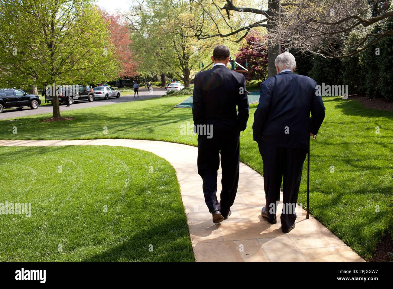 President Barack Obama and Senator Ted Kennedy walk on the grounds of the White House, before signing of the Kennedy Service Act  at the SEED School in Washington D.C.  4/21/09. .Official White House Photo by Pete Souza Stock Photo