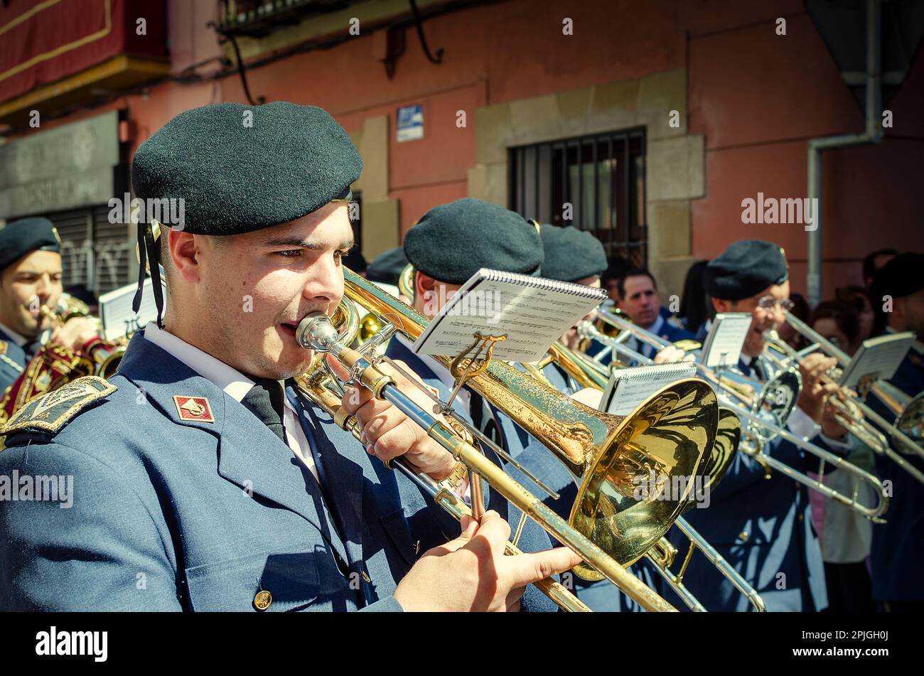 Seville, Spain; April 2, 2023: Group of musicians during a procession of the Holy Week. Brotherhood of La Hiniesta. Palm Sunday. Stock Photo
