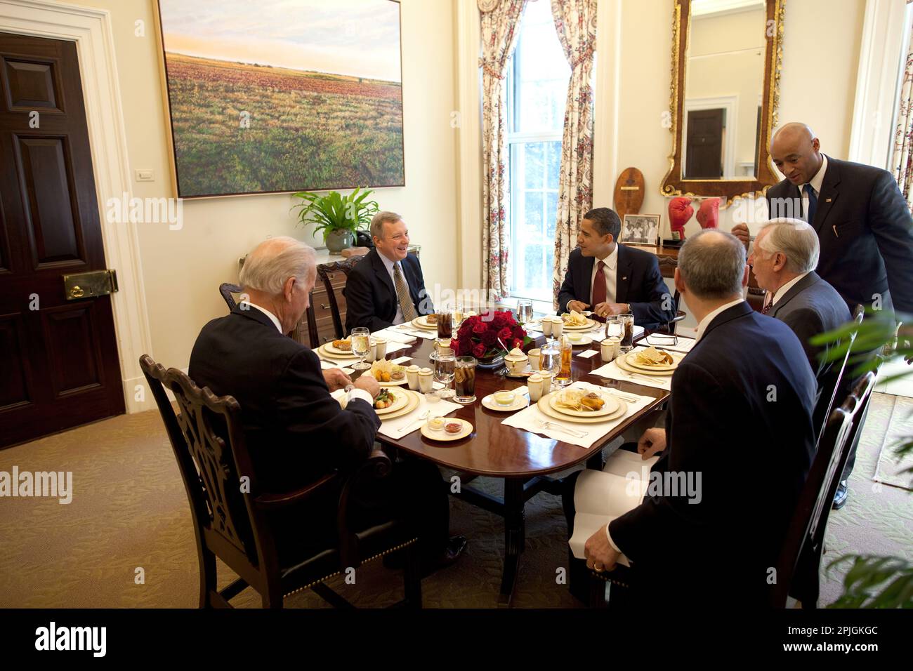 President Barack Obama and Congressional Members, Senator Richard Durbin and Rep. Steny Hoyer eat lunch with Vice President Joe Biden and Assistant to the President for Legislative Affairs Phil Schiliro in the Oval Office Private Dining Room 3/12/09. .Official White House Photo by Pete Souza Stock Photo