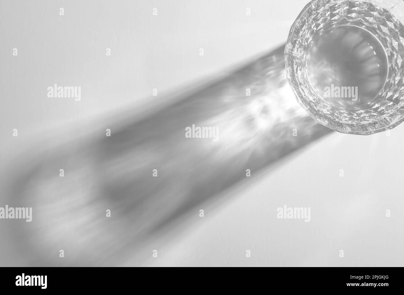 A Glass with Water and Sharp Shadows, Caustic Effect as Light Passes