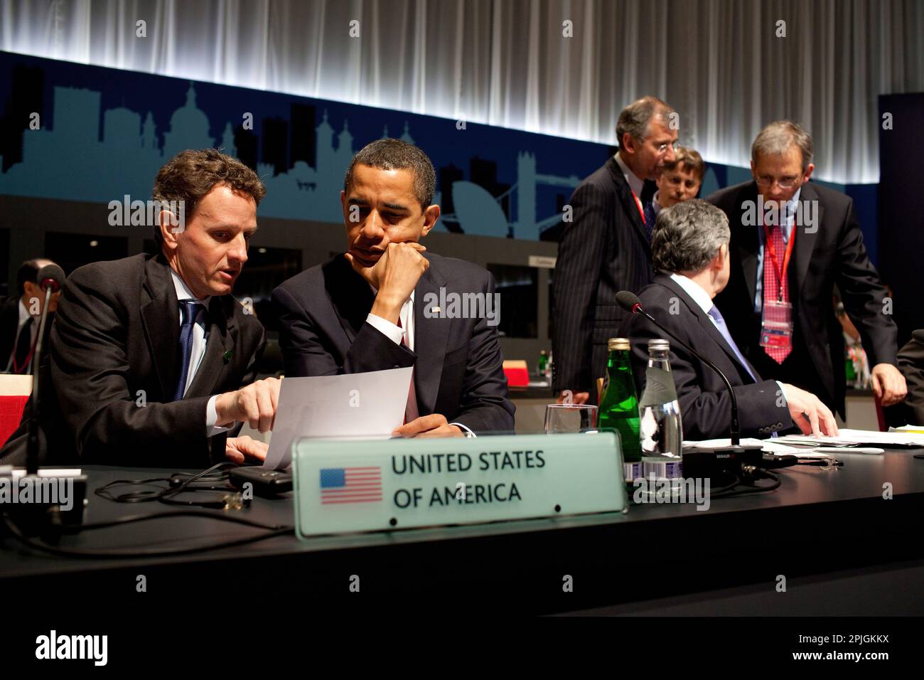 President Barack Obama confers with U.S. Treasury Secretary Timothy Geithner during the G-20 Summit  April 2, 2009, at the ExCel Centre in London. Official White House Photo by Pete Souza Stock Photo