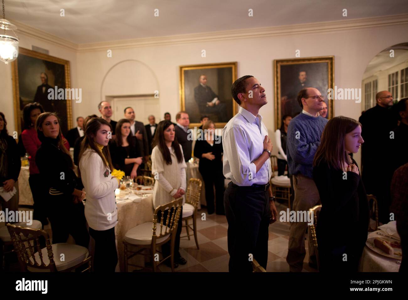 President Barack Obama with his hand on his heart as the National Anthem is played, prior to Super Bowl game kickoff, Arizona Cardinals vs. Pittsburgh Steelers in the East Garden Room of the White House 2/1/09. Official White House Photo by Pete Souza Stock Photo