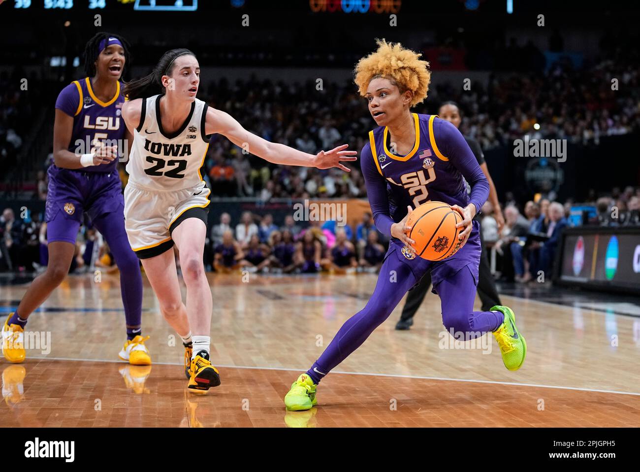 LSU's Jasmine Carson drives past Iowa's Caitlin Clark during the first