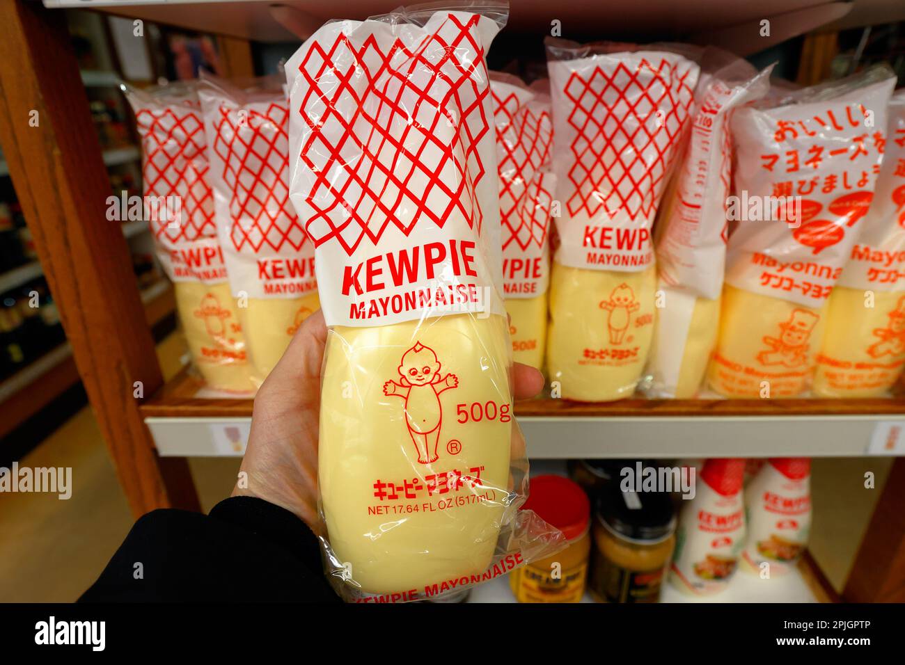 A 500g bottle of Kewpie mayo. Kewpie is a flavorful Japanese Mayonnaise made with only egg yolks, oil, vinegar blend, and some MSG. Stock Photo