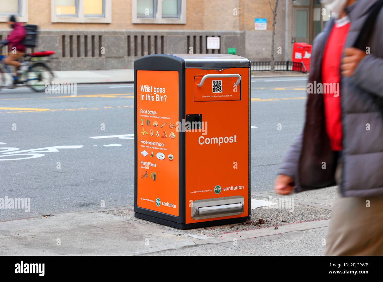 A NYC Smart Compost bin on a street in Upper Manhattan, New York City. These collection bins are unlocked via an app. Compost contents are liquified ... Stock Photo