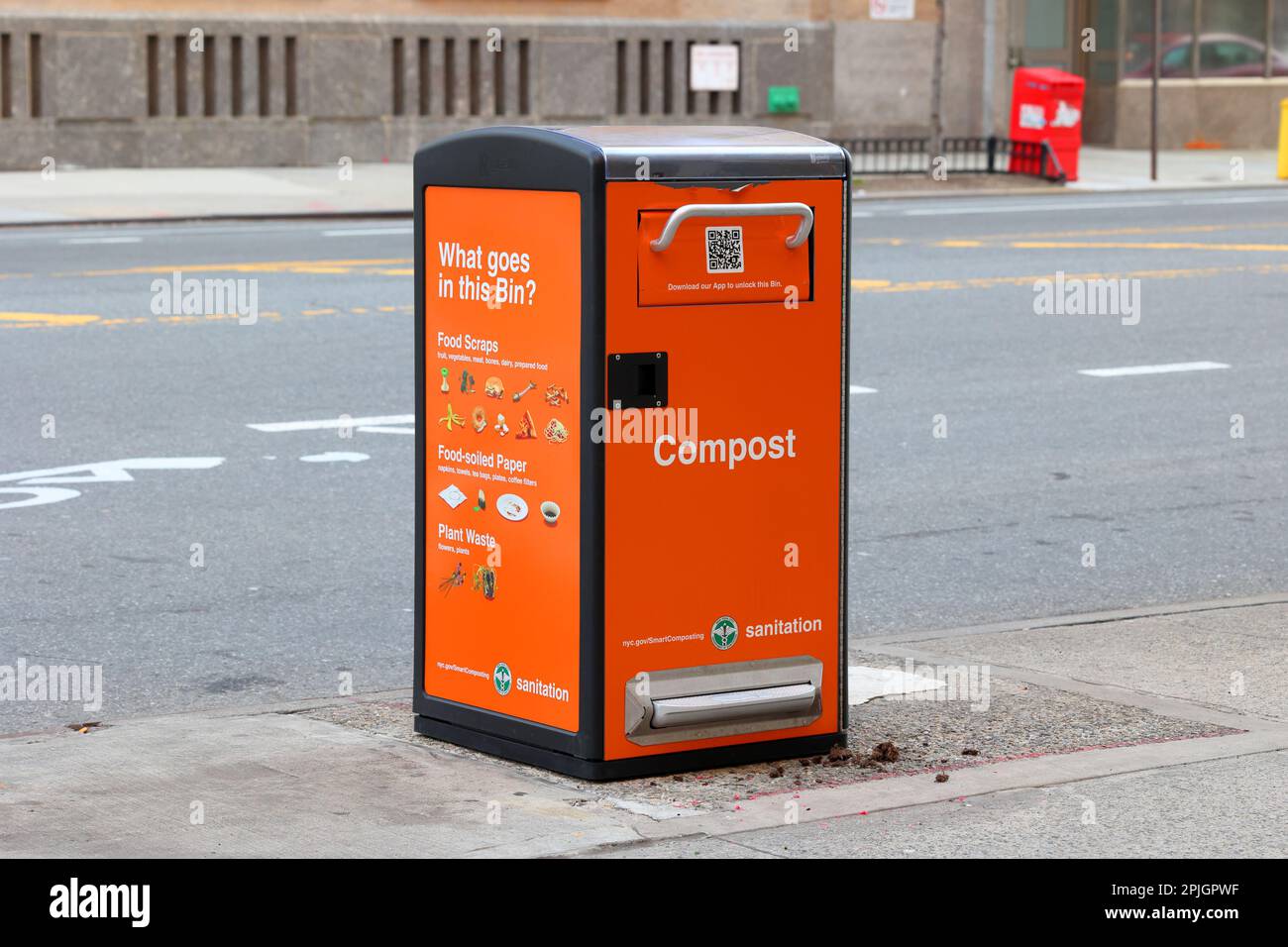 A NYC Smart Compost bin on a street in Upper Manhattan, New York City. These collection bins are unlocked via an app. Compost contents are liquified ... Stock Photo