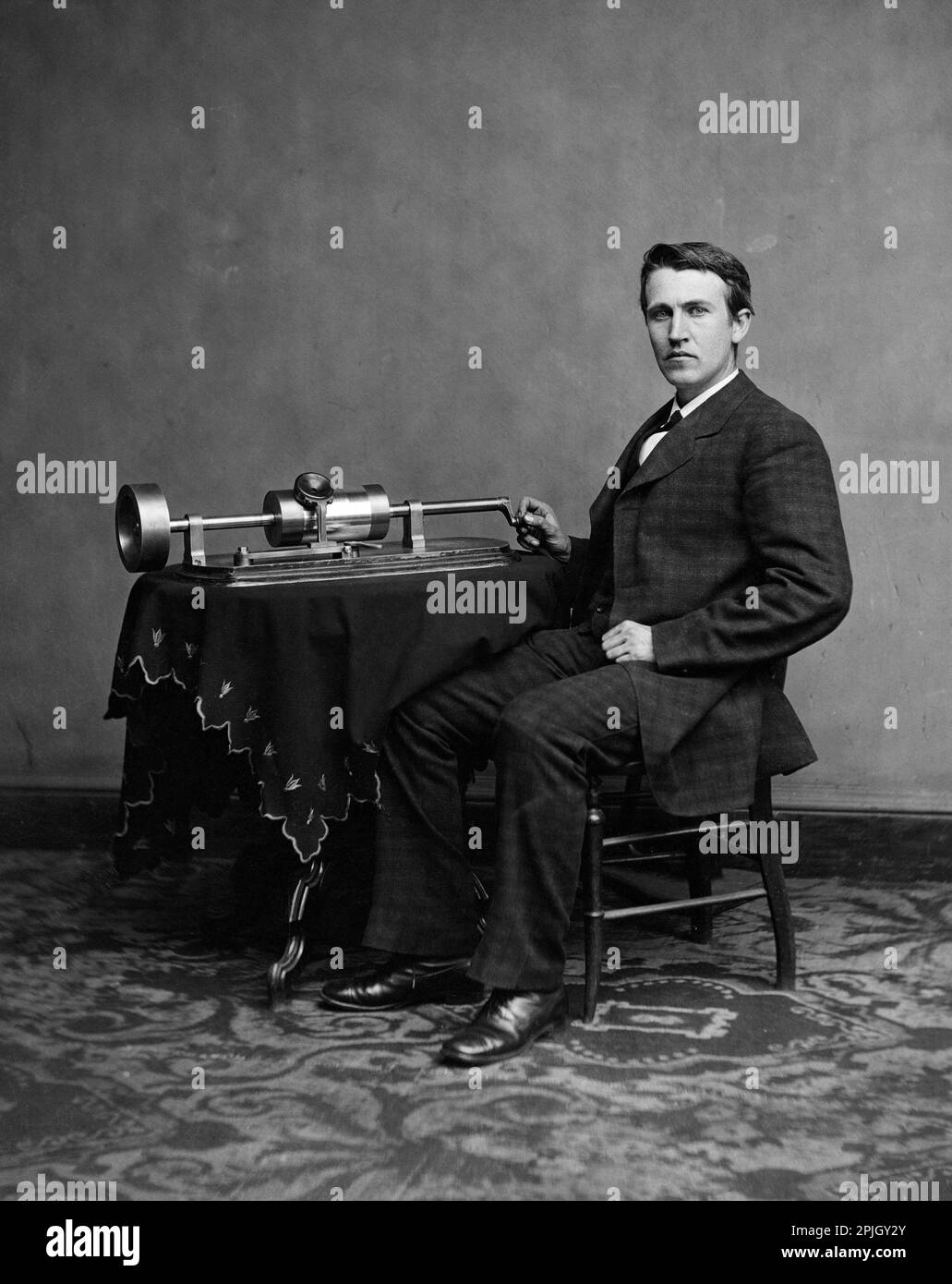 A portrait photograph of Thomas Edison and phonograph, by Levin Corbin Handy. c1877. Stock Photo