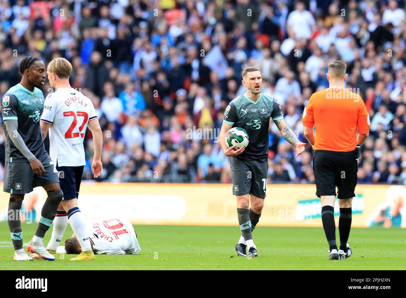 London, UK. 02nd Apr, 2023. Danny Mayor of Plymouth Argyle protests his innocence to referee, Ben Toner during the EFL Papa Johns Trophy Final match between Bolton Wanderers and Plymouth Argyle at Wembley Stadium, London, England on 2 April 2023. Photo by Carlton Myrie. Editorial use only, license required for commercial use. No use in betting, games or a single club/league/player publications. Credit: UK Sports Pics Ltd/Alamy Live News Stock Photo