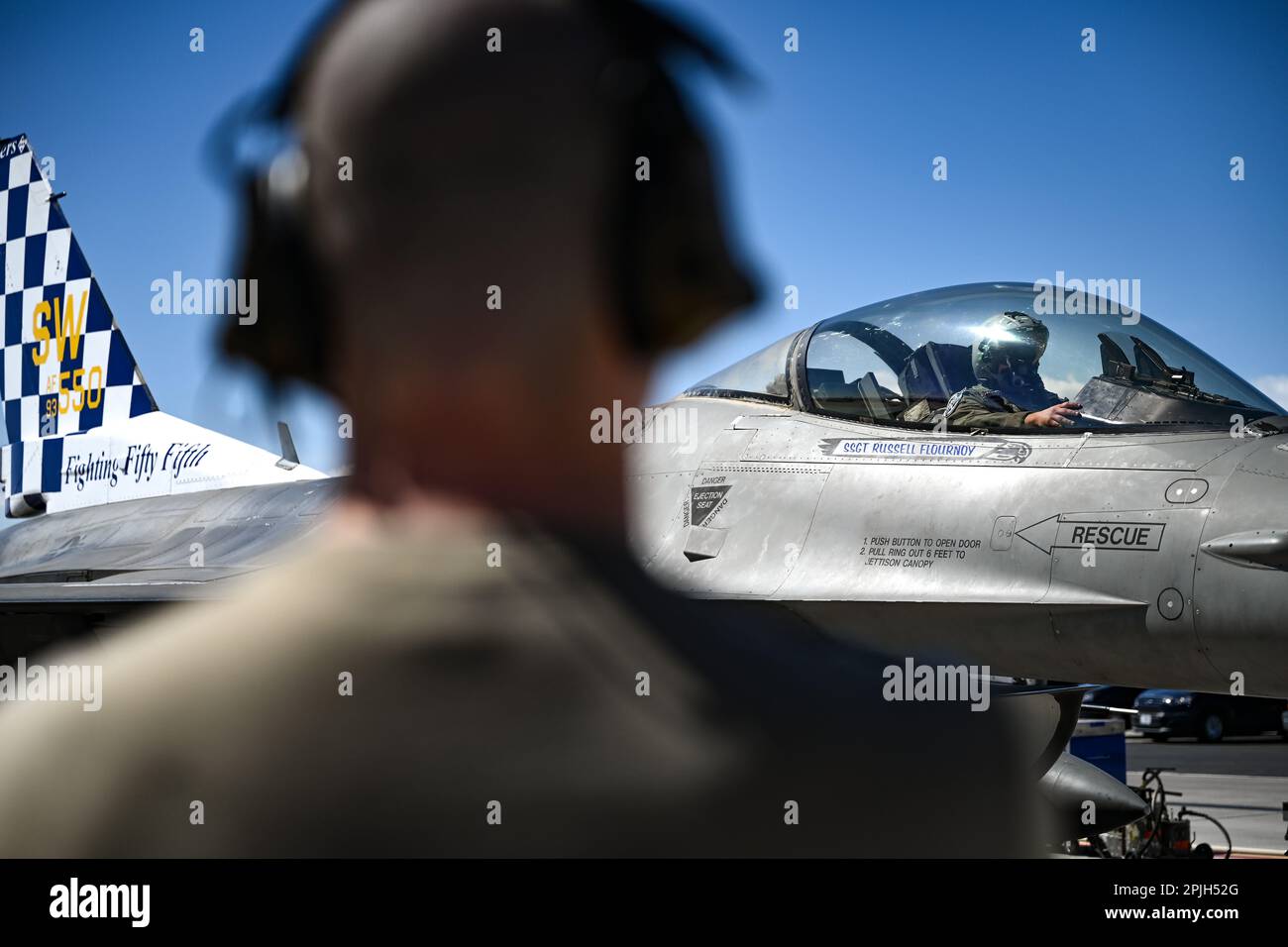 A U.S. Air Force pilot assigned to the 55th Fighter Squadron performs final checks before taxiing during the first day of exercise Red Flag-Nellis (RF-N) 23-2 at Nellis Air Force Base, Nevada, March 13, 2023. Through dedicated training opportunities like RFN 23-2, Wild Weasels ensure combat readiness and the tactical proficiency needed to maintain a ready force, capable of ensuring the collective defense of the United States and their partners and allies. (U.S. Air Force photo by Staff Sgt. Madeline Herzog) Stock Photo