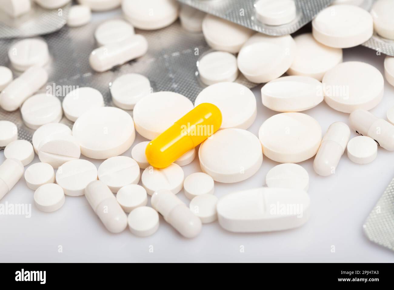 Orange drug capsule with white tablets Stock Photo Alamy