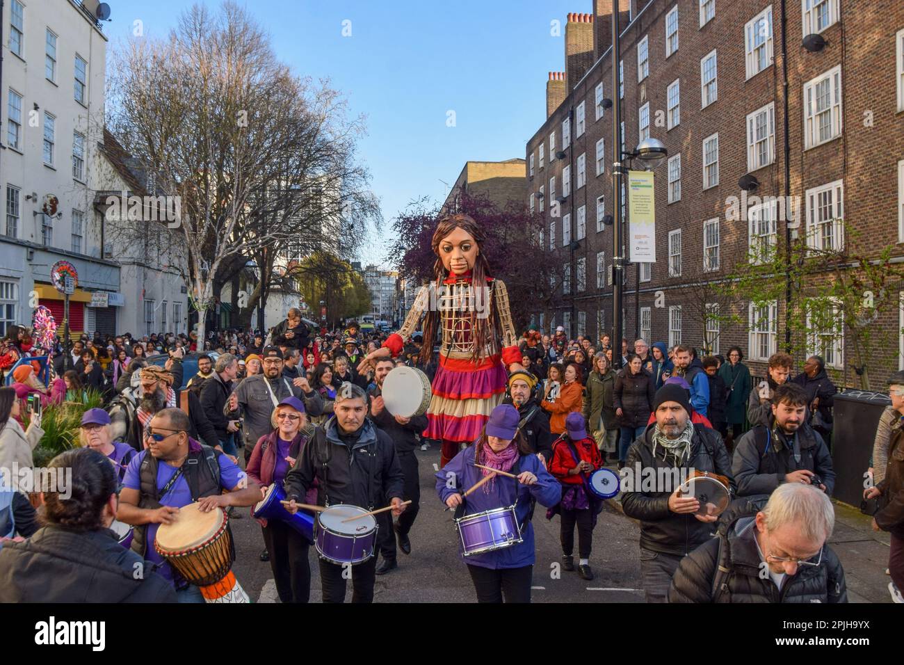 London, UK. 2nd April 2023. Crowds flock around Little Amal, the 3.5