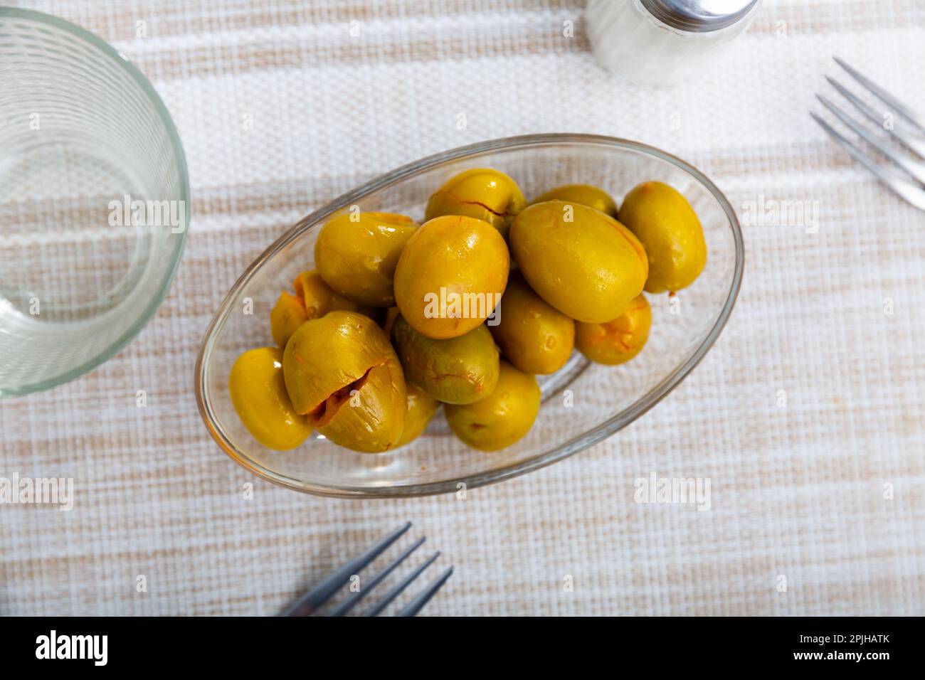 Pickled green olives with a stone Stock Photo Alamy